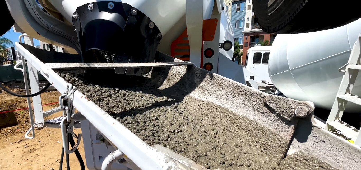 High-quality concrete being poured from truck for professional finish